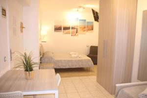 Postel nebo postele na pokoji v ubytování All'Etrusconia Hotel Castagneto Carducci