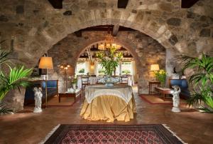 Postel nebo postele na pokoji v ubytování Relais Osteria Dell'Orcia