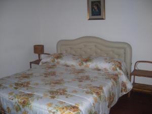 Postel nebo postele na pokoji v ubytování B&B L'Arcobaleno
