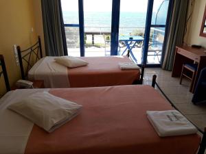 Postel nebo postele na pokoji v ubytování Hotel Dimitra