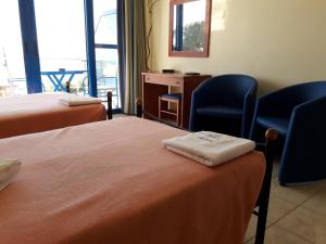 Postel nebo postele na pokoji v ubytování Hotel Dimitra