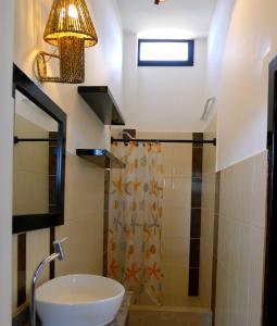 a bathroom with a sink and a shower at Hotel Sotavento in Montañita