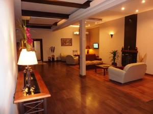 a living room with a couch and a table at Hotel Ideal Resto Bar in Colorado River