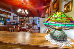 a stained glass lamp sitting on top of a table at Royal Antique Apartment in Split