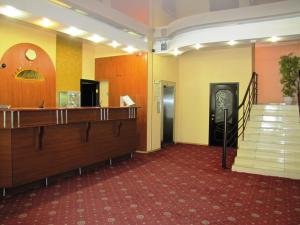 a room with a staircase and a stair case at Severnye Zori Hotel in Cherepovets