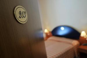 Posteľ alebo postele v izbe v ubytovaní Sait Hotel & BB