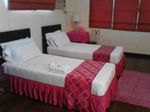 מיטה או מיטות בחדר ב-Casa Joaquin BnB