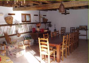 a dining room with a table and chairs at Les Perrières in Saint-Germain-la-Ville