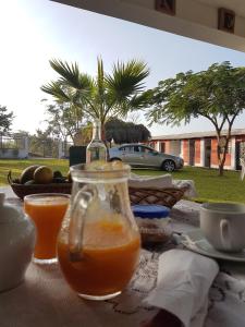 a bottle of orange juice sitting on top of a table at La Viña de OsCar in Nuevo Imperial