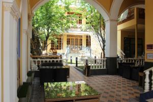 an empty church with a reflection in the water at Atlas B&B Hotel in Dushanbe