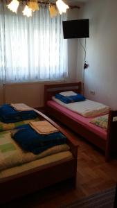 Postel nebo postele na pokoji v ubytování Guest House Potok