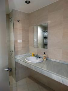 a bathroom with a sink and a mirror at Loft in the heart of Córdoba by gms apartamentos in Córdoba