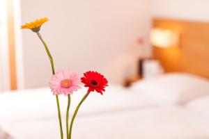Postel nebo postele na pokoji v ubytování Hotel.Pension.Golingen