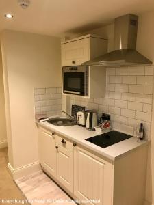 a kitchen with a sink and a counter top at No.10 Preston in Preston
