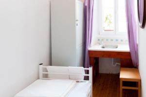 Posteľ alebo postele v izbe v ubytovaní Old Town Hostel