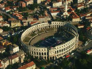 an aerial view of a large building in a city at Luka in Pula