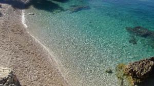 an aerial view of a beach with rocks and water at Luka in Pula