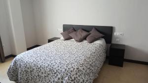 Posteľ alebo postele v izbe v ubytovaní Apartamento Comedias