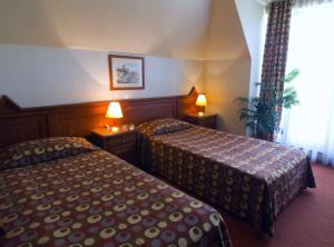Postel nebo postele na pokoji v ubytování Hotel Central