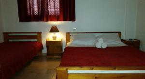 Postel nebo postele na pokoji v ubytování Villa Xenia