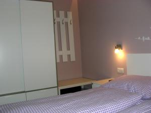 Postel nebo postele na pokoji v ubytování Alpine Appartement