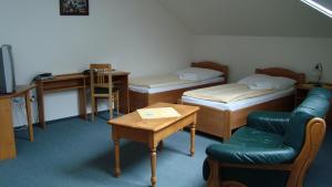 Postel nebo postele na pokoji v ubytování Hotel Krakonoš