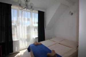 Postel nebo postele na pokoji v ubytování Villa Amadea