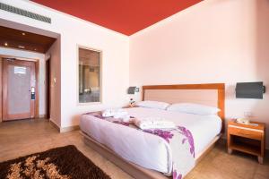 Rúm í herbergi á Barceló Tiran Sharm