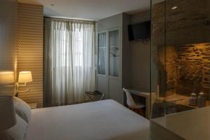 Postel nebo postele na pokoji v ubytování Hotel Atalaia
