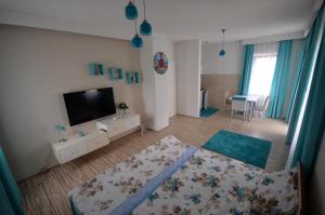 Postel nebo postele na pokoji v ubytování Antonio Apartments