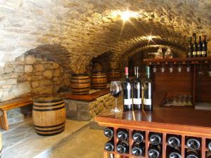 a wine cellar with a bunch of wine bottles at Apartman Park in Trebinje