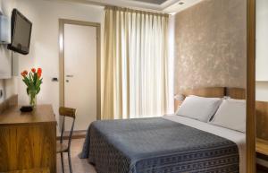 Posteľ alebo postele v izbe v ubytovaní ACasaMia WelcHome Hotel
