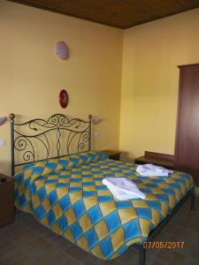 Postel nebo postele na pokoji v ubytování Agriturismo Colle del Sindaco