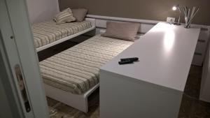 A bed or beds in a room at Sole di Maggio