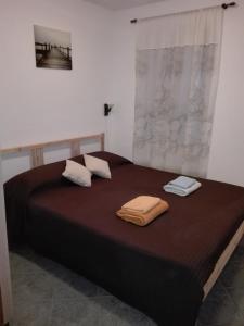 Postel nebo postele na pokoji v ubytování Studios Dalino
