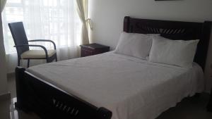 Postel nebo postele na pokoji v ubytování Hotel La Vieja Sara