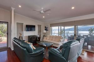 a living room with a couch and chairs and a table at Esperance Landing in Dover