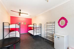a room with two bunk beds in it at Adventurers Backpackers in Townsville