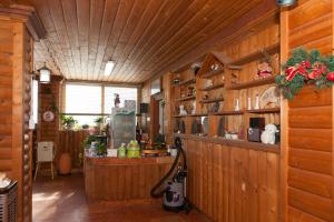 a kitchen with wooden walls and a counter in a room at Sunrise Pension in Hwaseong
