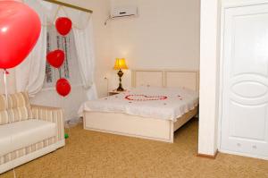 Postel nebo postele na pokoji v ubytování Galian Hotel