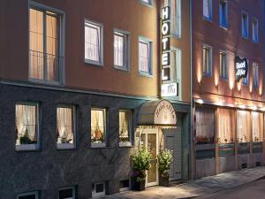 a building with a sign on the side of it at Hotel Alfa Zentrum in Munich