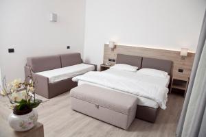 Posteľ alebo postele v izbe v ubytovaní Albergo Grobberio