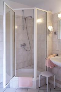 Ванная комната в Hotel Alt Oesselse