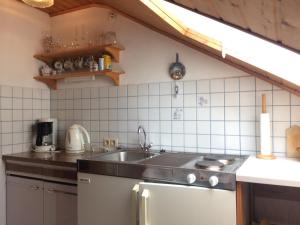 a kitchen with a sink and a counter top at Haus am Wald in Bayerisch Eisenstein