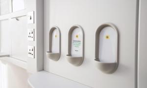 a row of urinals on a wall in a bathroom at Point A Hotel London Shoreditch in London