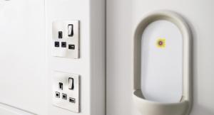 two electrical switches on a wall next to each other at Point A Hotel London Shoreditch in London
