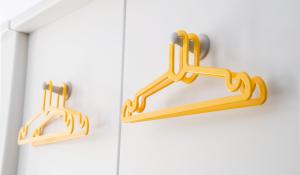 a pair of gold handles on a white door at Point A Hotel London Shoreditch in London