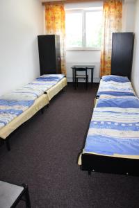 Postel nebo postele na pokoji v ubytování Sporthotel BK Pod Lipou