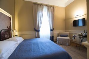 Postel nebo postele na pokoji v ubytování Locanda di Pietracupa