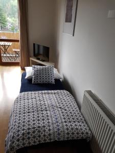 Posteľ alebo postele v izbe v ubytovaní Apartment 353 Liptov Town